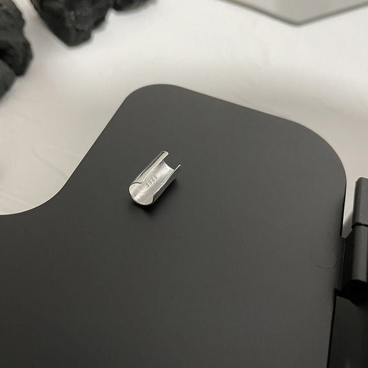 Minimalist sterling silver ear cuff with a sleek cylinder design for a modern and edgy look.