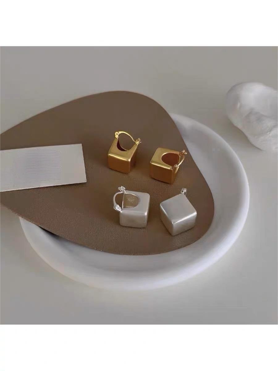 Matte square drop earrings in gold and silver with a square geometric modern design for a bold yet elegant look.