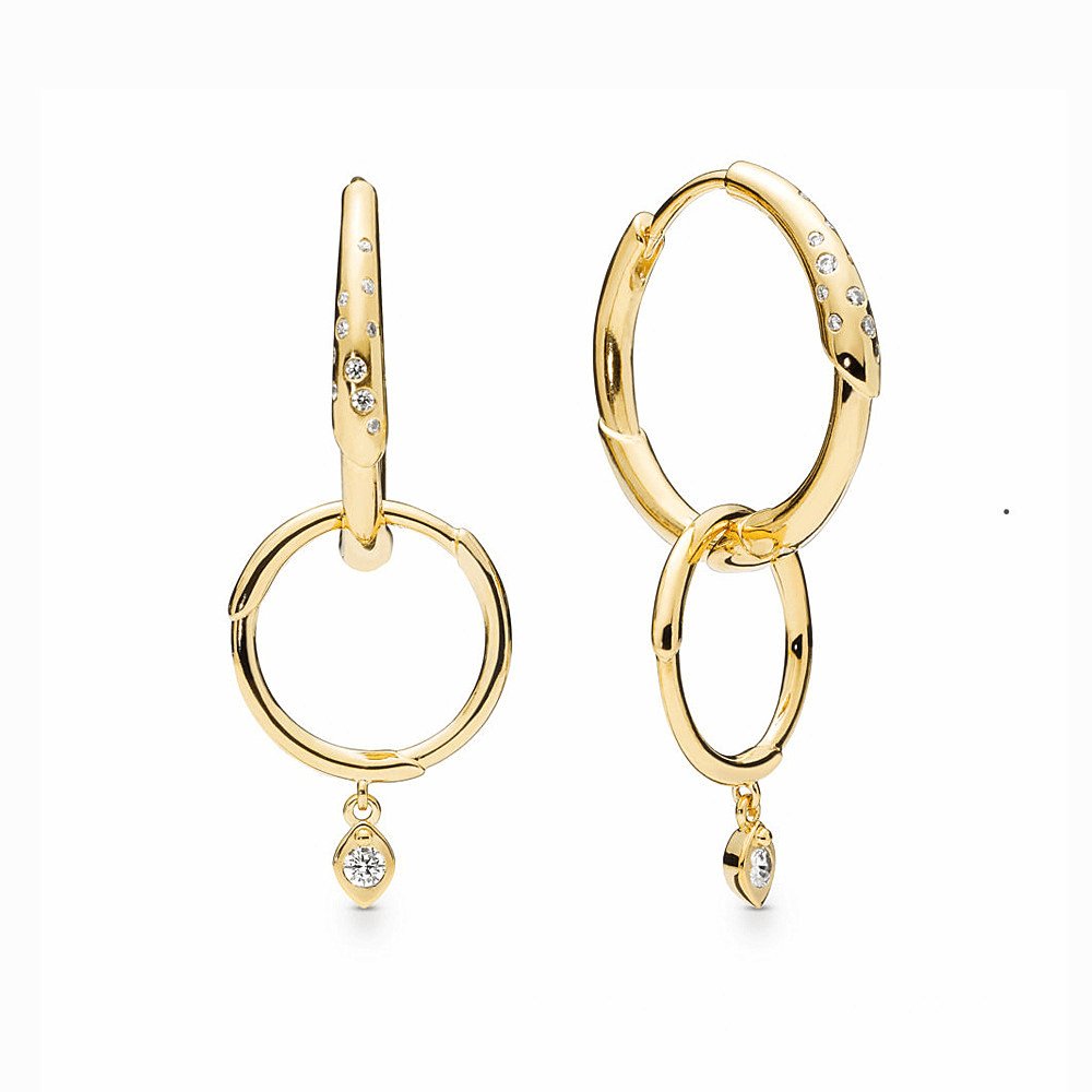 Gold hoop earrings with an interchangeable diamond charm for a versatile and stylish look.
