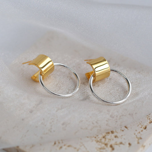 ep out of your comfort zone and step into the spotlight with these gold hoops and silver circle drop earrings! 