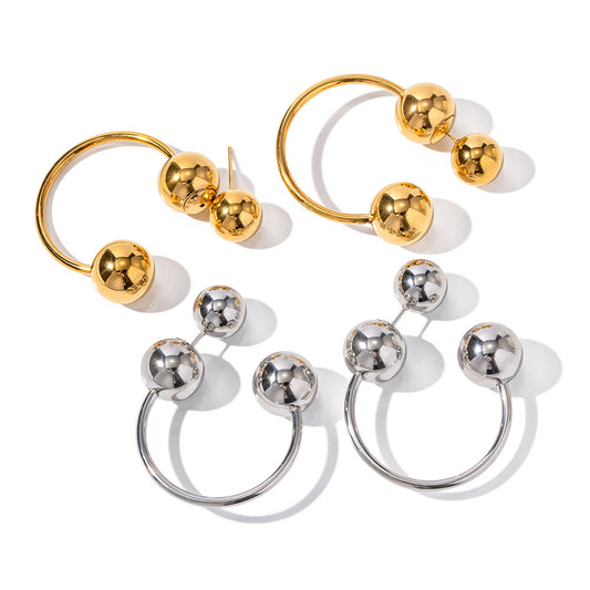 "I Sphere You" Hoop Earrings. Crafted with high-quality materials, these hoops feature a distinctive look with an eye-catching exaggerated spherical design.